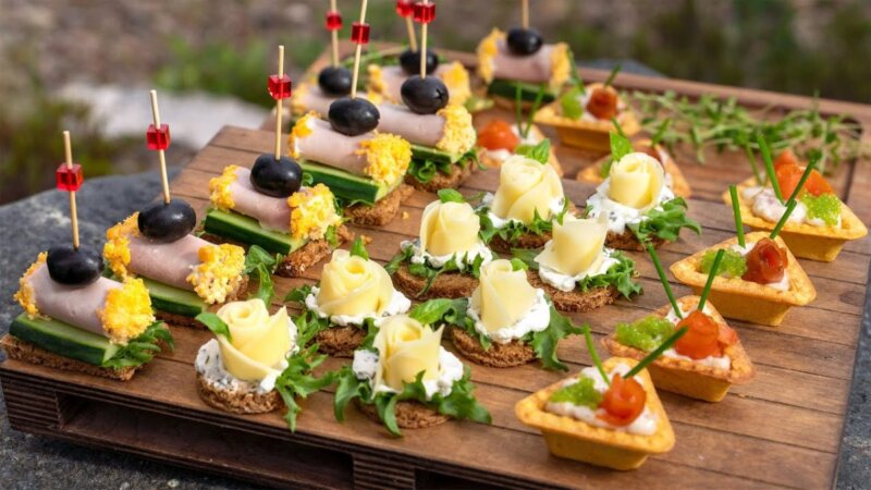delicious and unique finger food ideas for your next party: triangular stuffed pastries, mini rolls, and cheese roses!